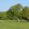 A sunny day view of a green at Lake Arbor Golf Course.