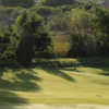 A sunny day view of a green at Valley Hi Municipal Golf Course.