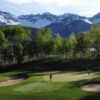 A view of a green flanked by bunkers at Telluride Golf Club.