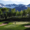 A view of a green flanked by bunkers at Telluride Golf Club.