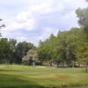 A view over the water of a hole at Columbine Country Club