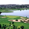 A view of green protected by bunkers at Country Club of Colorado