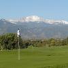 A view of a green with mountains in background from Patty Jewett Golf Club