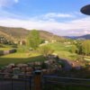 A view from the clubhouse of the putting green at Sonnenalp Club.