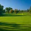 A sunny view of a green at Greg Mastriona Golf Courses at Hyland Hills