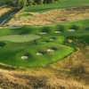 A view of green #13 protected by a collection of bunkers at Harmony Golf Club