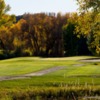 A view of a green protected by a bunker at Dos Rios Country Club