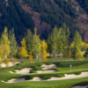 A fall view of a hole surrounded by bunkers at Maroon Creek Club