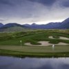 A view of a hole with water and sand traps coming into play at Crested Butte Country Club