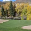 A view of the 3rd green protected by bunkers at Eagle Vail Golf Club
