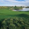 A view of green with water coming into play from right at Dunes at Riverdale Dunes Knolls Public Links