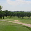 A view of green #3 with narrow road in foreground at Quail Dunes Golf Course