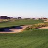 A view of the 14th fairway with bunkers in foreground and green in the back at Antler Creek Golf Course