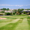 A view of green protected by bunkers with clubhouse in background at Thorncreek Golf Club