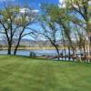 A view of the 8th hole that is played on a narrow, natural peninsula lined by trees at TPC Colorado.